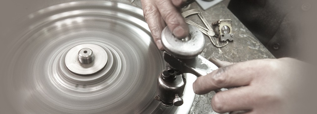Diamond being polished on a spinning lap wheel