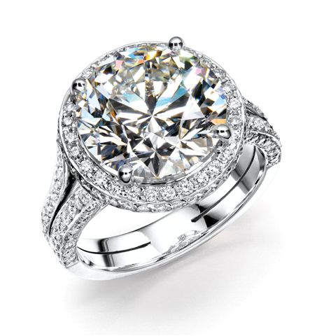 Round brilliant diamond halo ring with pavé band