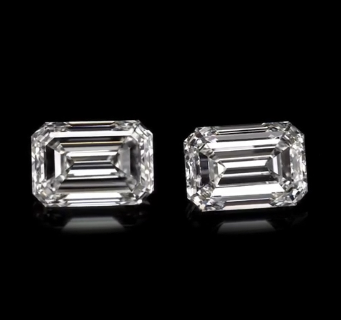 Pair of matched emerald-cut diamonds on black
