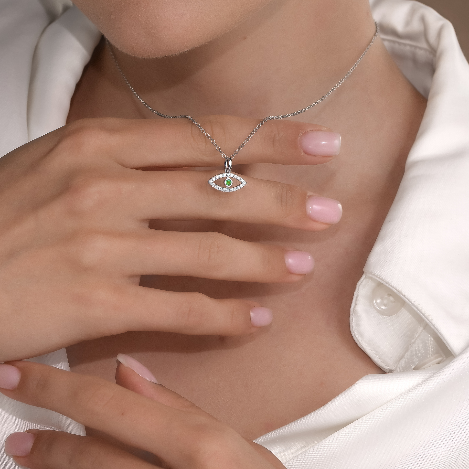 Diamond evil-eye pendant with emerald centre